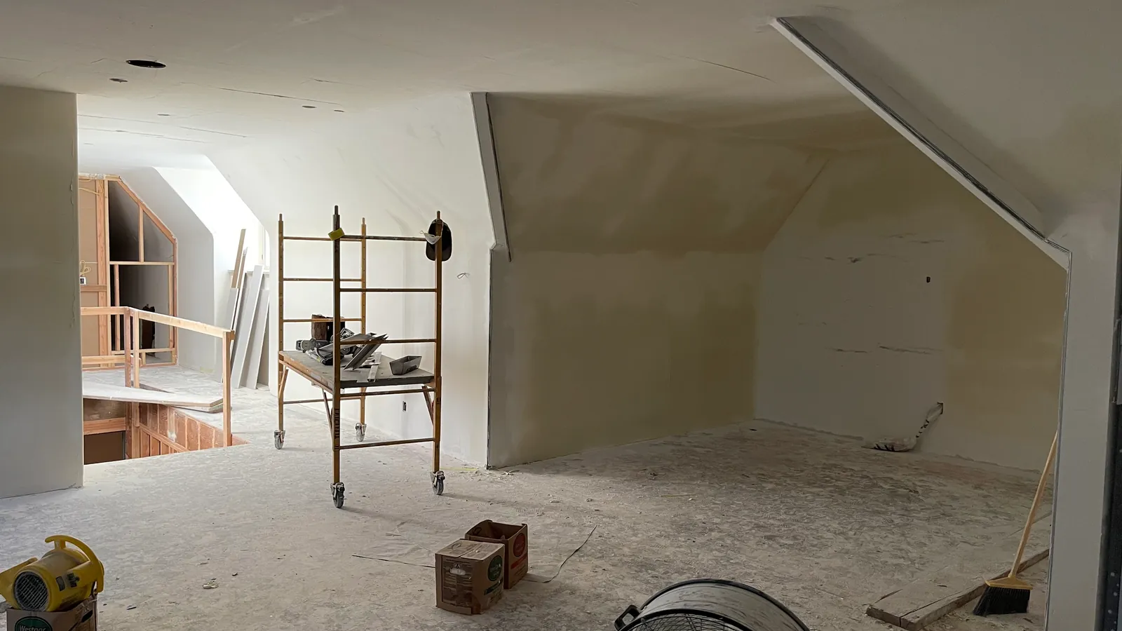 Vaulted upper-floor room finished smooth